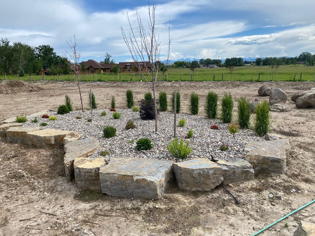 Boulder hardscaping with perennial garden plantings
