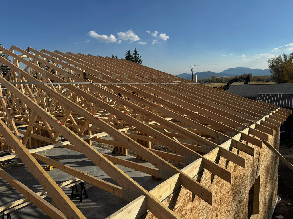 Roof trusses being coordinated during construction